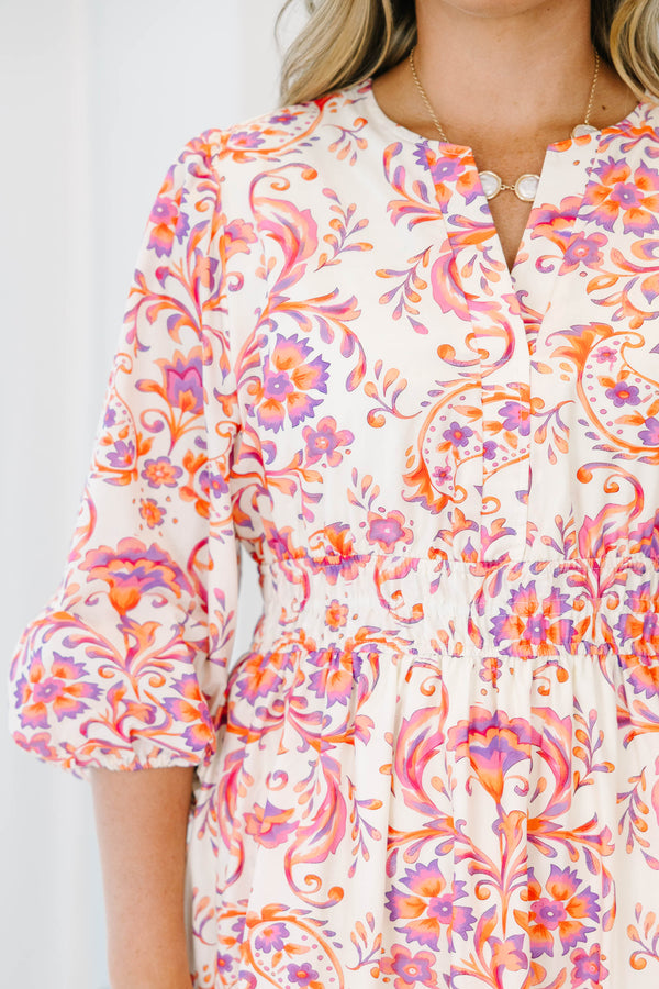 Plus Size pink and orange paisley print tiered maxi dress with puff sleeves and a button neckline.
