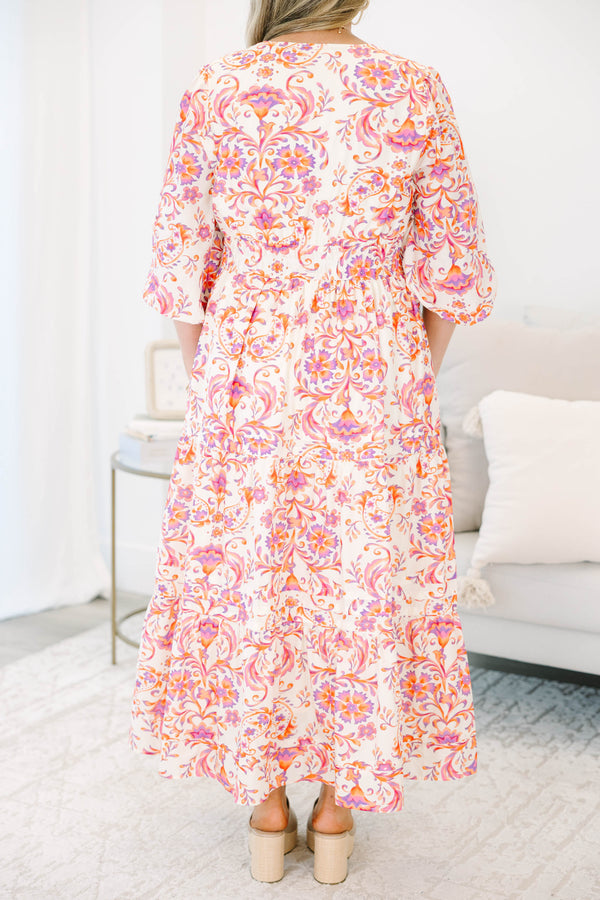 Plus Size pink and orange paisley print tiered maxi dress with puff sleeves and a button neckline.