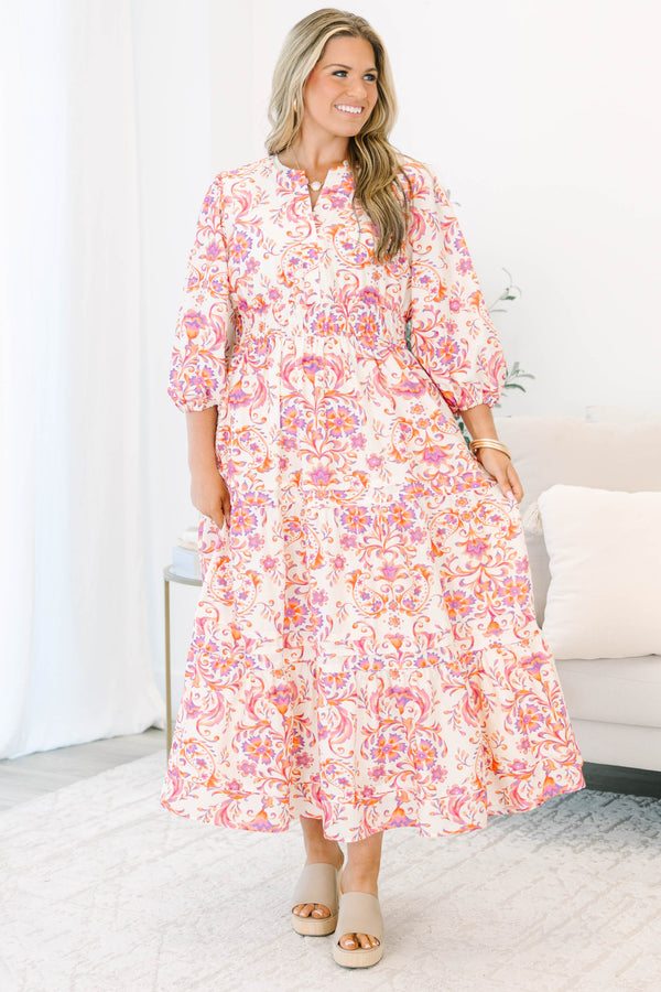Plus Size pink and orange paisley print tiered maxi dress with puff sleeves and a button neckline.