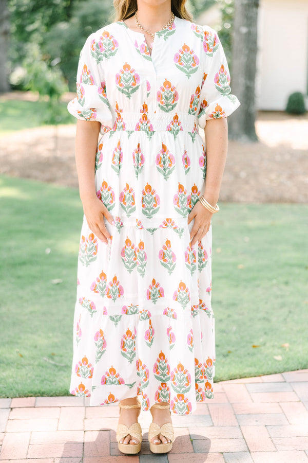 Plus Size white floral tiered maxi dress with short puff sleeves and a v-neckline.