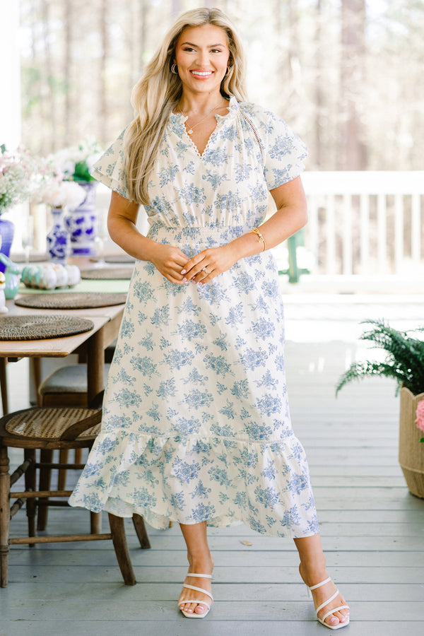 Chic Soul plus size clothing, short-puffed-sleeve flowy ruffled white midi dress with a scalloped split-v-neckline and a subtle blue floral pattern with a smocked waistline 