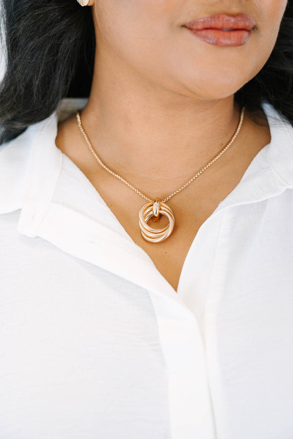 Plus Size gold necklace with three interlocking textured circles on a delicate chain.