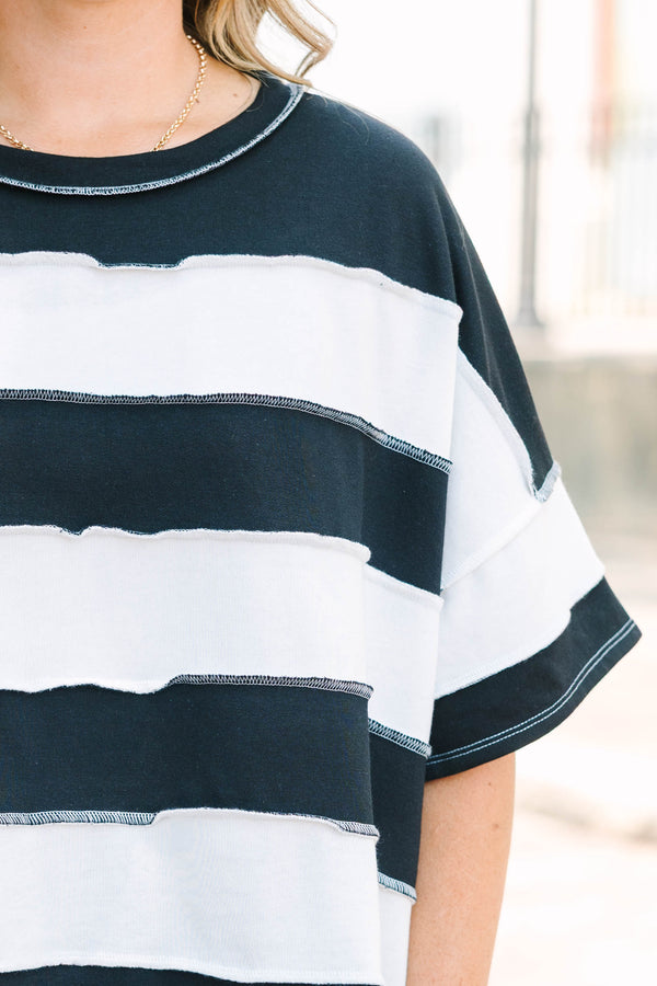Plus Size black and white horizontal striped top with raw-edge seams and short sleeves.