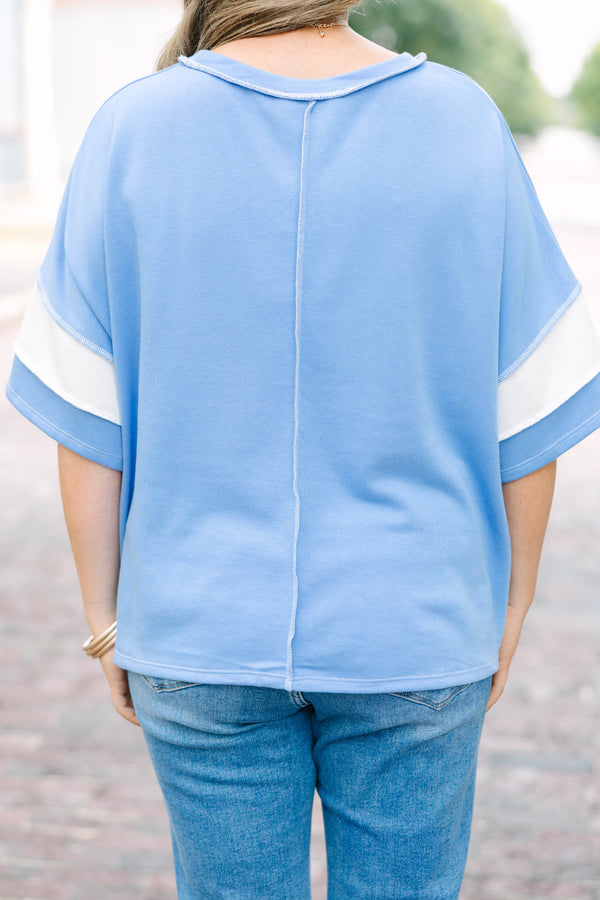 Plus Size cornflower blue and white striped French terry top with exposed seams and relaxed fit.
