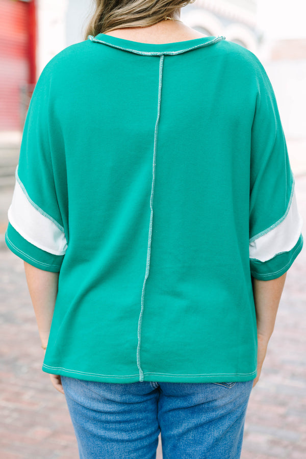 Plus Size kelly green and white striped French terry top with exposed seams and a relaxed fit.
