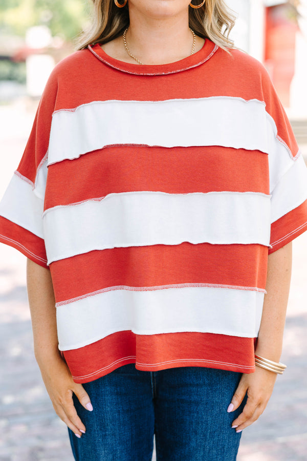 Plus Size rust and white striped French terry top with exposed seams and a relaxed fit.