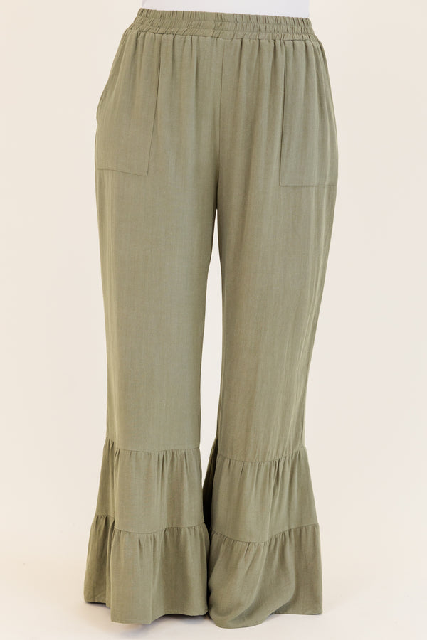 Chic Soul plus size clothing, dusty olive green wide leg flared pants with elastic waistband with ruffled detailing on flare and side pockets