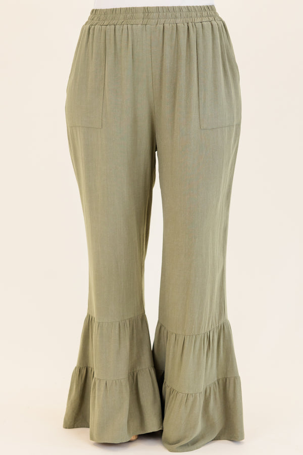 Chic Soul plus size clothing, dusty olive green wide leg flared pants with elastic waistband with ruffled detailing on flare and side pockets