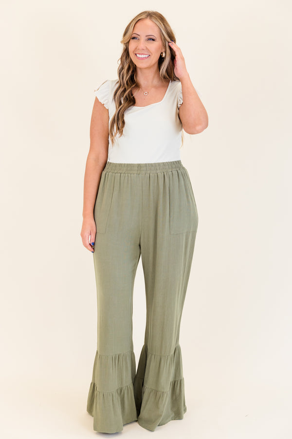 Chic Soul plus size clothing, dusty olive green wide leg flared pants with elastic waistband with ruffled detailing on flare and side pockets