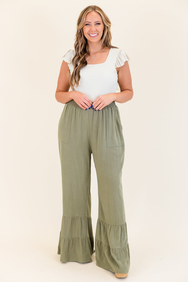 Chic Soul plus size clothing, dusty olive green wide leg flared pants with elastic waistband with ruffled detailing on flare and side pockets