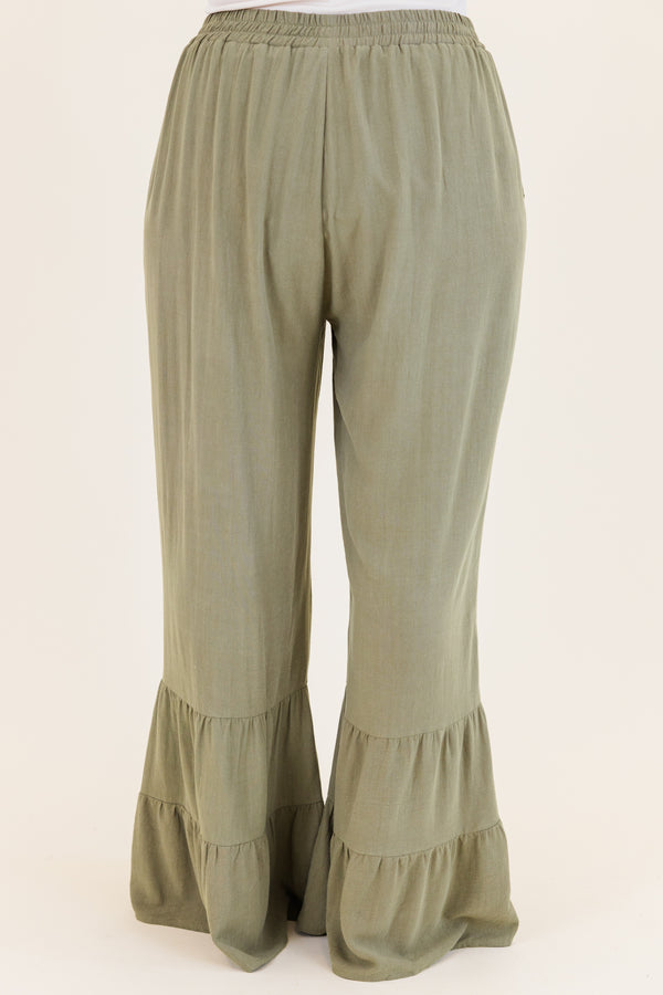 Chic Soul plus size clothing, dusty olive green wide leg flared pants with elastic waistband with ruffled detailing on flare and side pockets