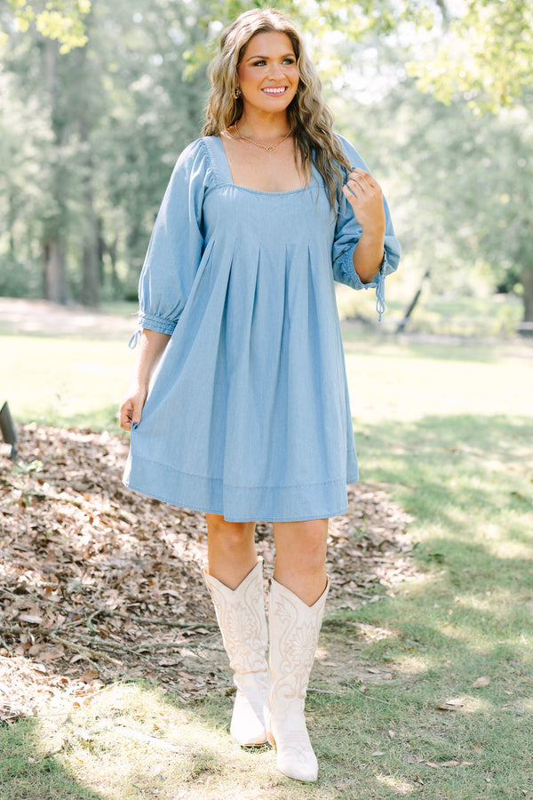 Plus Size light blue denim-look dress with a square neckline, pleated bodice, and puff sleeves.