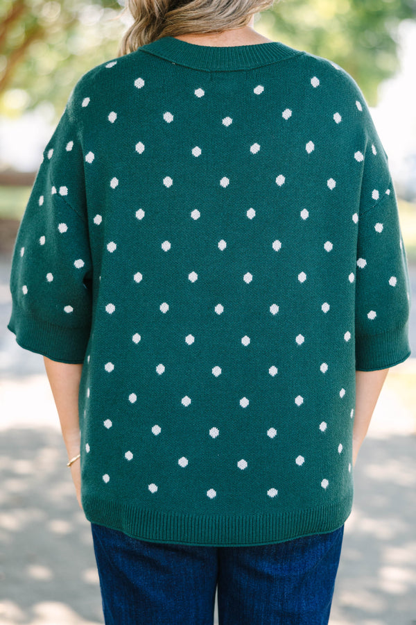 Plus Size hunter green knit sweater with white polka dots, crew neck, and wide three-quarter sleeves.