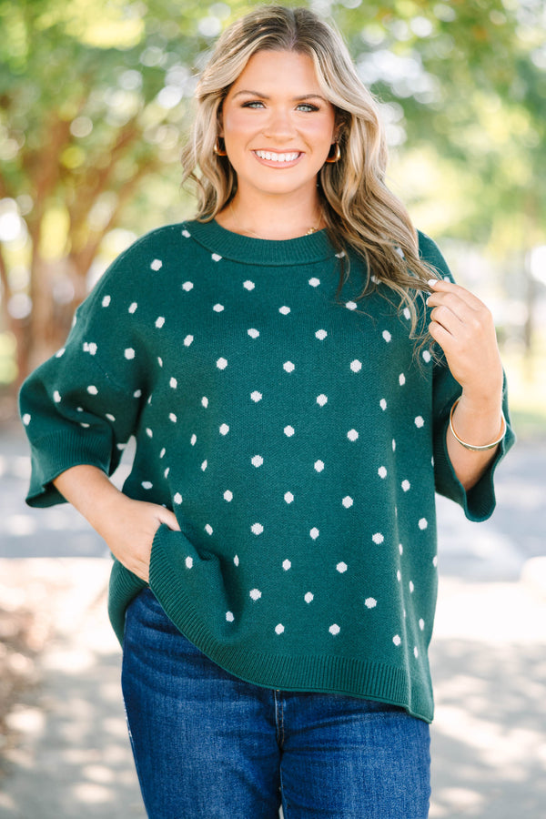 Plus Size hunter green knit sweater with white polka dots, crew neck, and wide three-quarter sleeves.