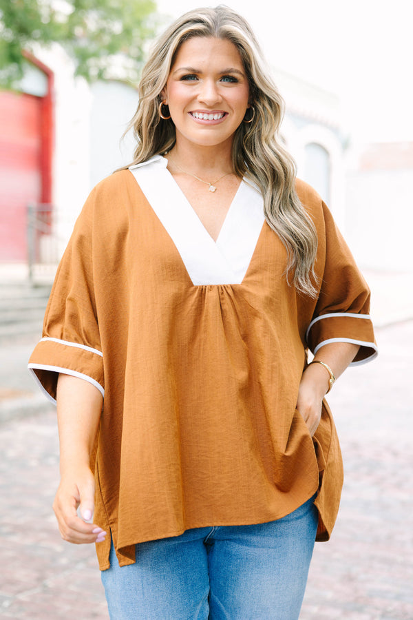 Plus Size brown tunic blouse with a white V-neck collar, relaxed fit, and white trim on the sleeves.