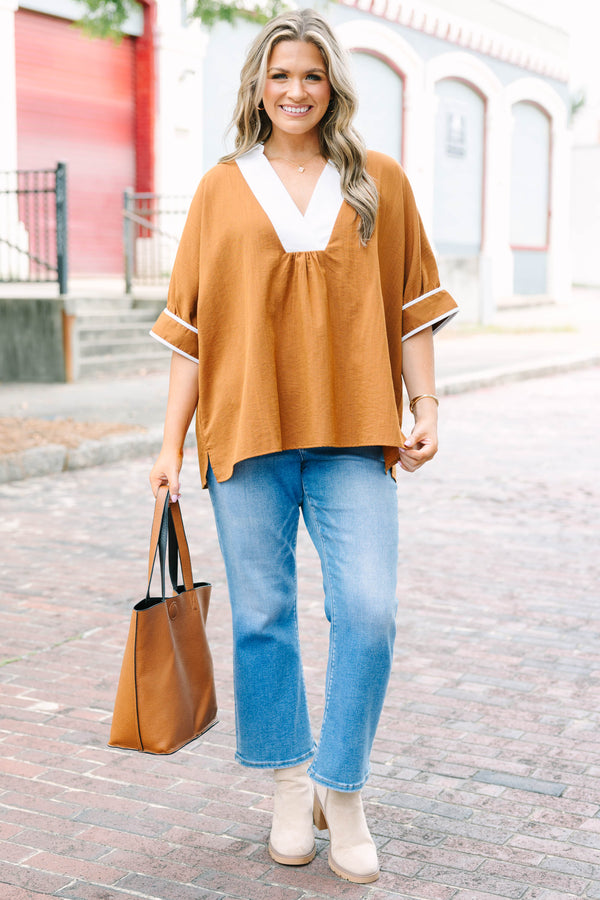 Plus Size brown tunic blouse with a white V-neck collar, relaxed fit, and white trim on the sleeves.