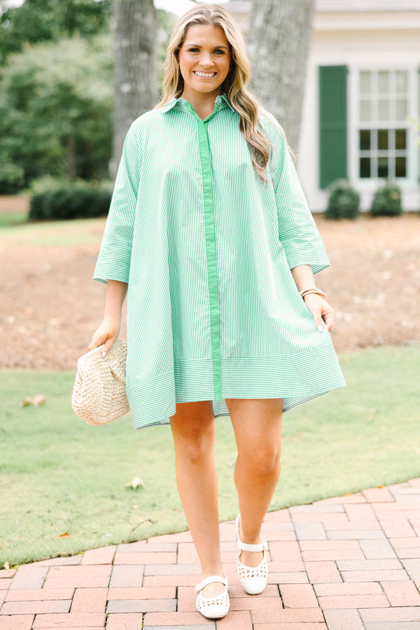 Plus size green and white striped cotton shirt dress with three-quarter sleeves and a flowy fit.