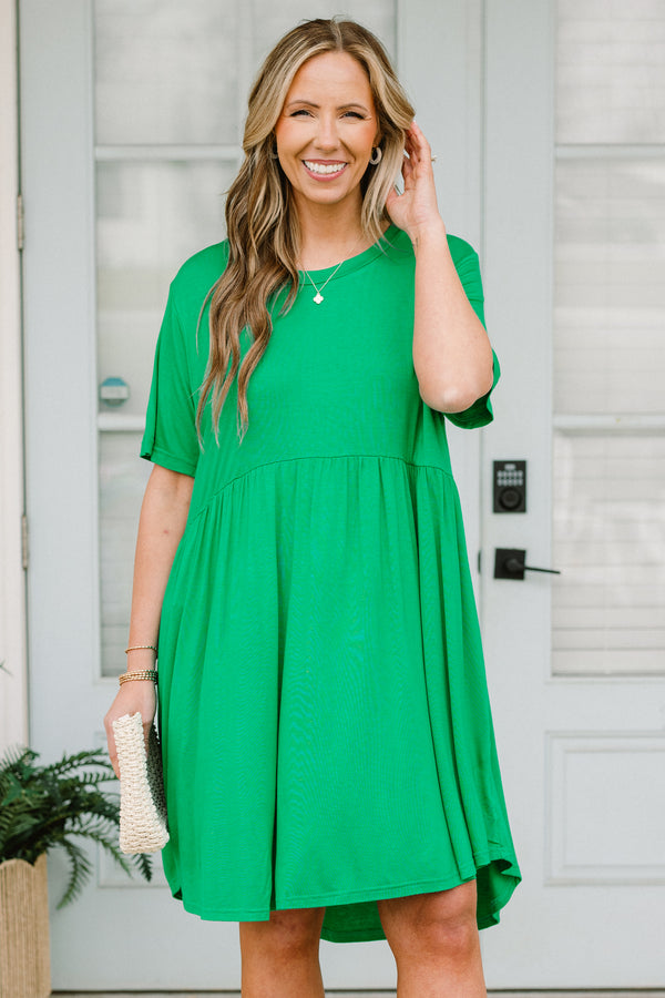 Plus Size emerald green short sleeve baby doll dress with a crew neckline and tiered skirt.