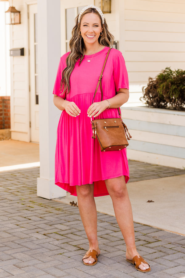 Plus Size fuchsia short sleeve babydoll dress with a round neckline and high-low hemline.