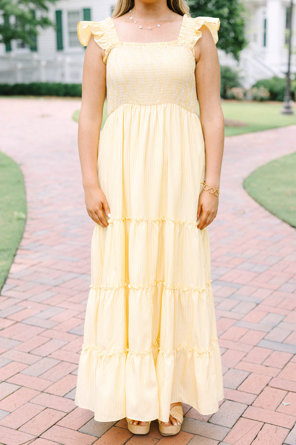 Plus Size yellow striped maxi dress with a smocked bodice, ruffled straps, and a tiered skirt.