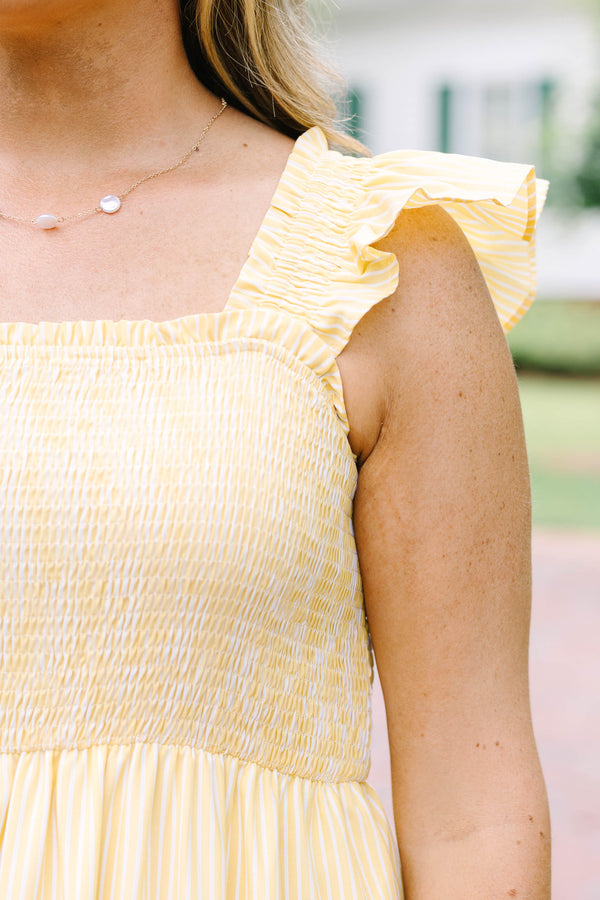 Plus Size yellow striped maxi dress with a smocked bodice, ruffled straps, and a tiered skirt.