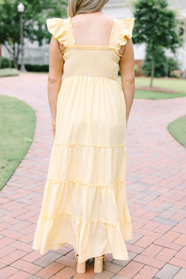 Plus Size yellow striped maxi dress with a smocked bodice, ruffled straps, and a tiered skirt.