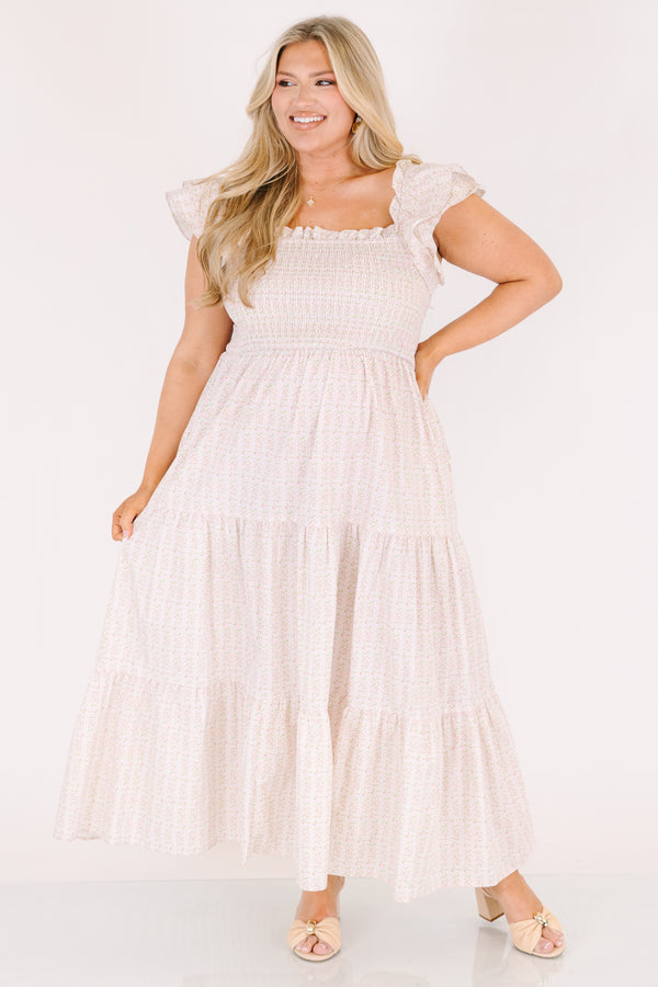 Chic Soul plus size clothing, pink maxi tiered maxi dress with a smocked texture on the bust a square neckline and flutter sleeves as well as a small floral pattern throughout 