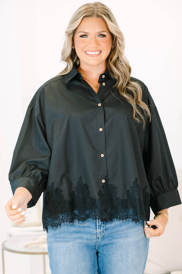 Plus size black button-down top with a flowy fit and delicate lace hem detail.