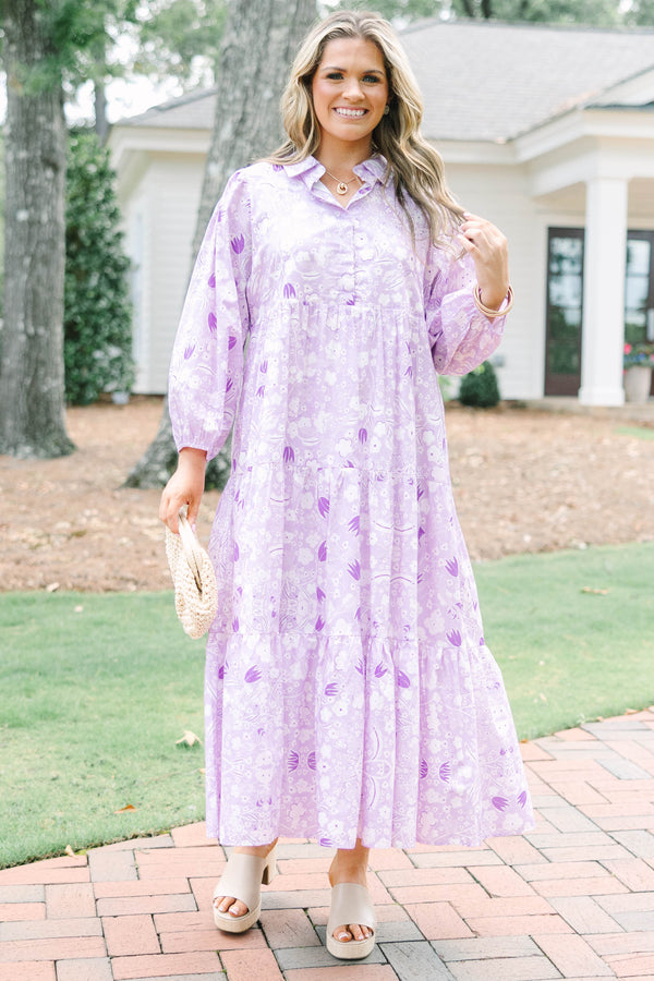 Plus size flowy lilac floral tiered maxi dress with long sleeves and a collared neckline.