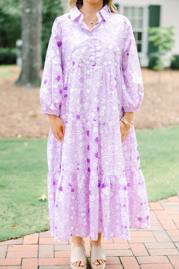 Plus size flowy lilac floral tiered maxi dress with long sleeves and a collared neckline.