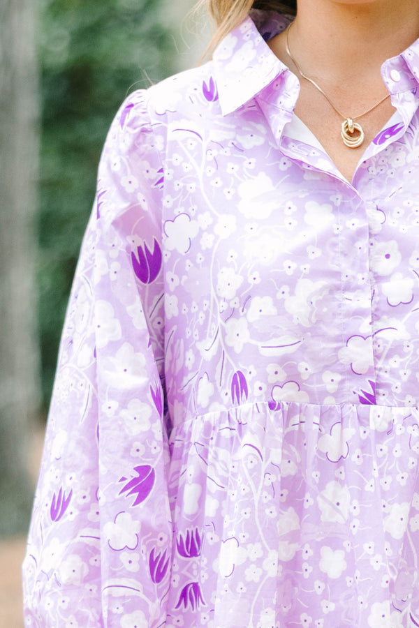 Plus size flowy lilac floral tiered maxi dress with long sleeves and a collared neckline.