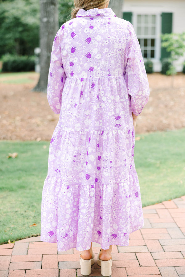 Plus size flowy lilac floral tiered maxi dress with long sleeves and a collared neckline.