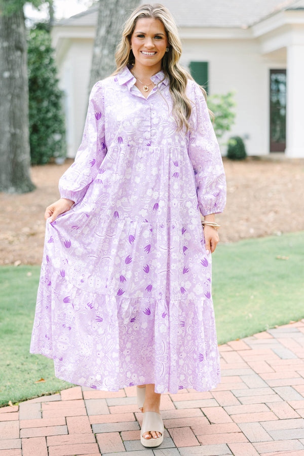 Plus size flowy lilac floral tiered maxi dress with long sleeves and a collared neckline.