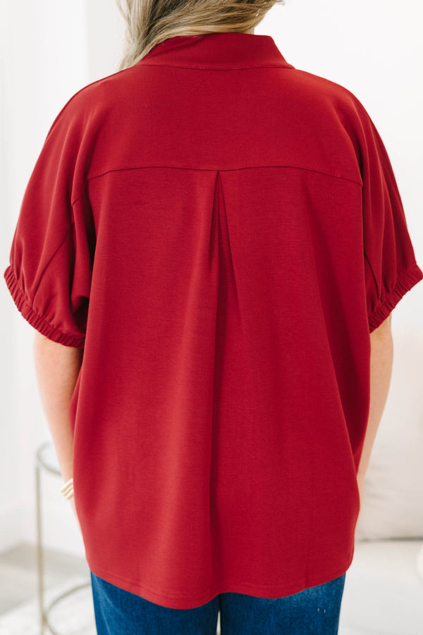 Plus Size cabernet red top with a v-neckline, relaxed fit, and short elasticized sleeves.