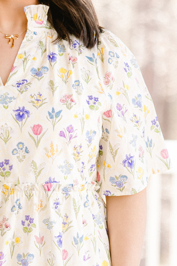 Chic Soul plus size clothing, short-sleeve white ruffled baby doll dress with a split-v-neckline and a multi-colored floral pattern