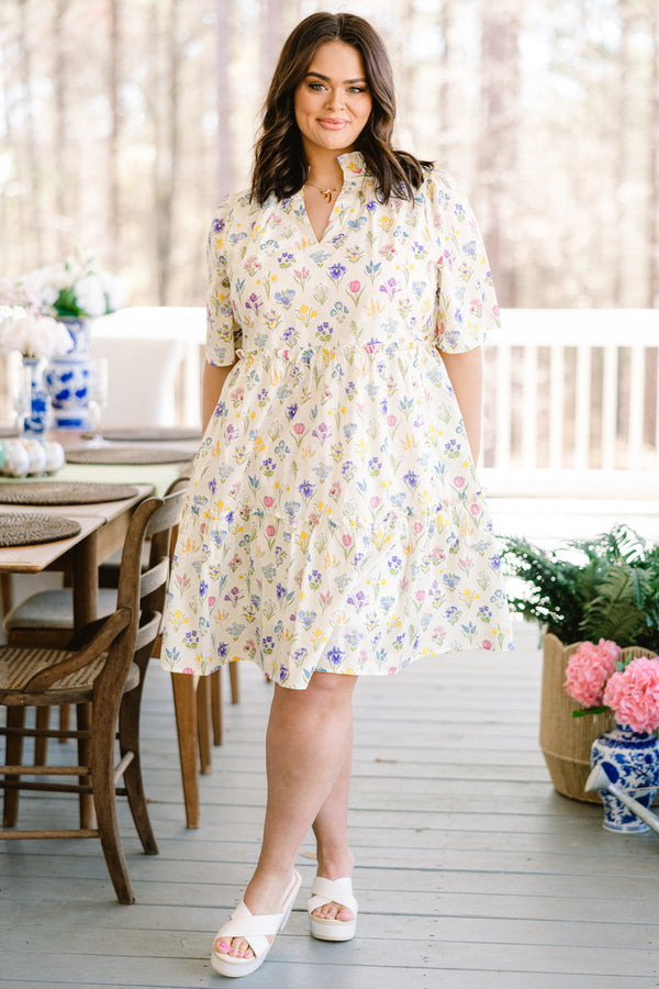 Chic Soul plus size clothing, short-sleeve white ruffled baby doll dress with a split-v-neckline and a multi-colored floral pattern