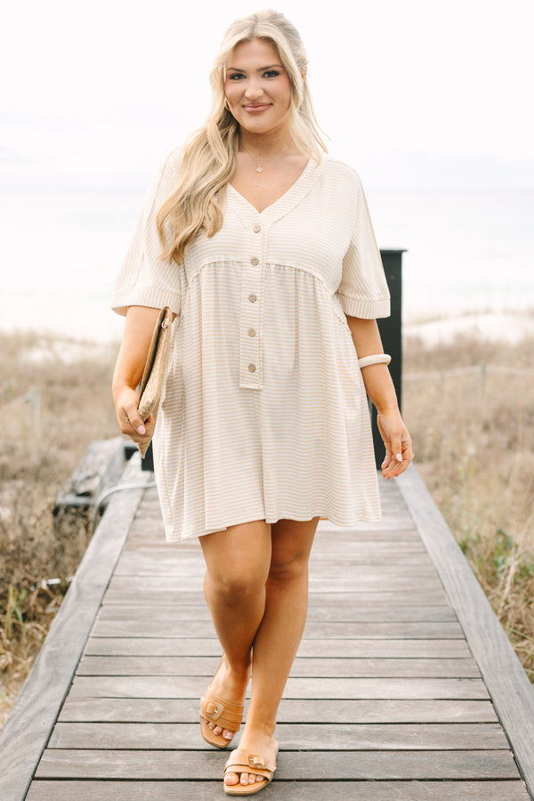 Chic Soul plus size clothing,  brown striped romper with short sleeves that have cuffs at the end of them as well as a v-neckline and buttons going down the center of the chest to the bottom of the belly 
