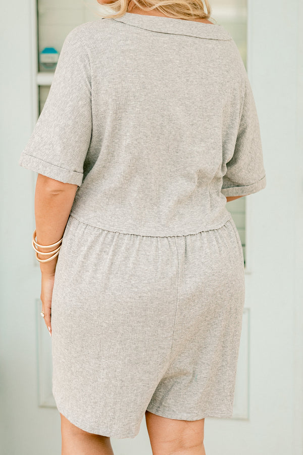 Plus Size heather grey short sleeve romper with a V-neckline and functional front buttons.