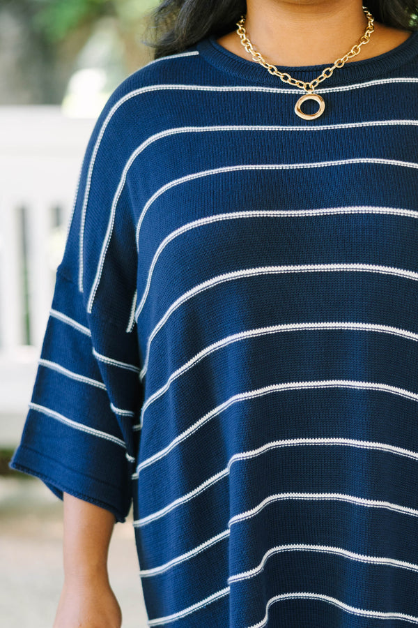 Plus Size navy and white horizontal striped knit sweater tunic with a relaxed fit and wide sleeves.