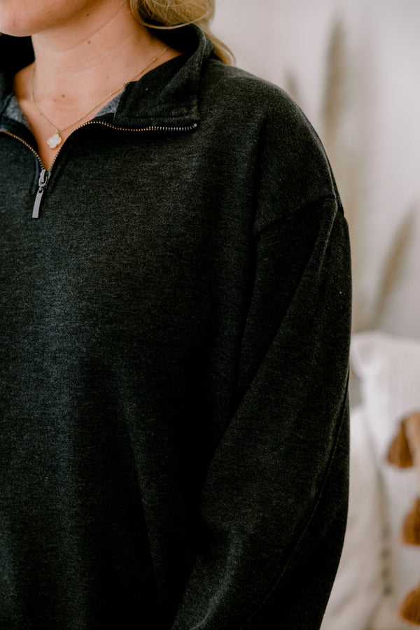 Chic Soul plus size clothing, black long sleeve pullover with a zipper that goes down to the top of the chest as well as a collar 