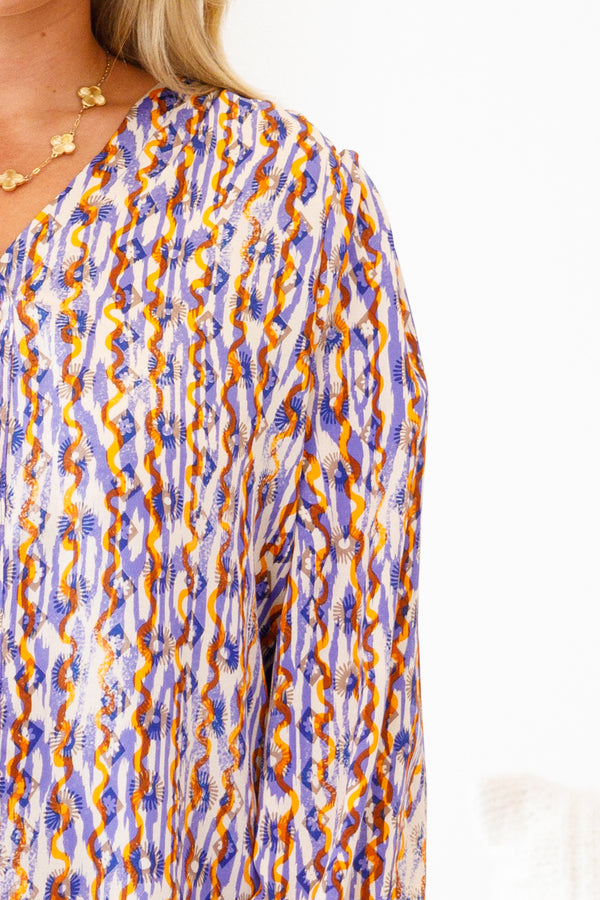 Chic Soul Plus size clothing, multi-color long sleeve top with an abstract pattern and slight v-neckline
