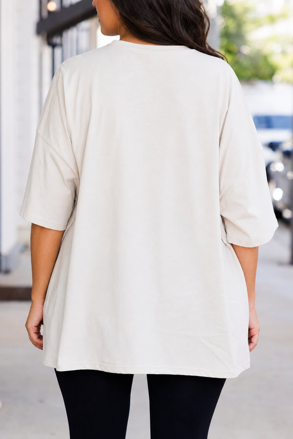 Chic Soul plus size clothing, short-sleeve dust tan boyfriend tee with orange graphic lettering stating 