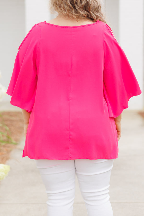 Plus Size hot pink flowy top with cold shoulder sleeves and white denim pants.