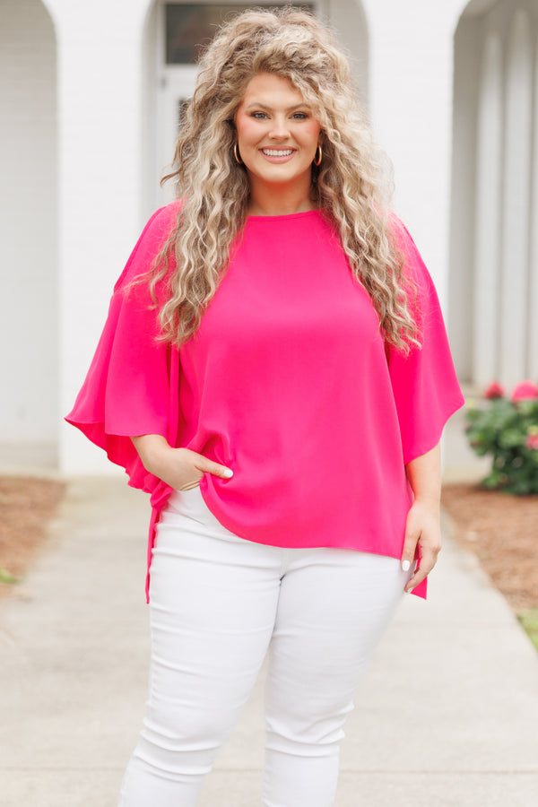 Plus Size hot pink flowy top with cold shoulder sleeves and white denim pants.