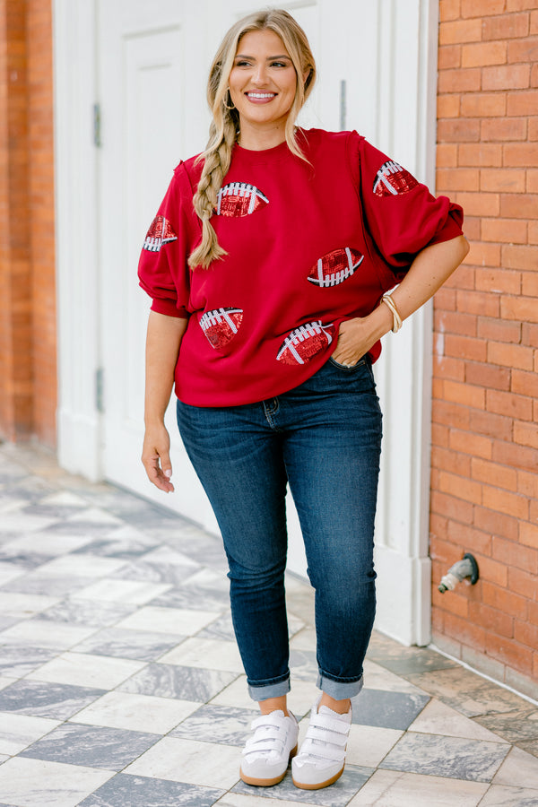 Chic Soul plus size clothing, red top with bubble sleeves that has red sparkly football patches throughout the shirt 