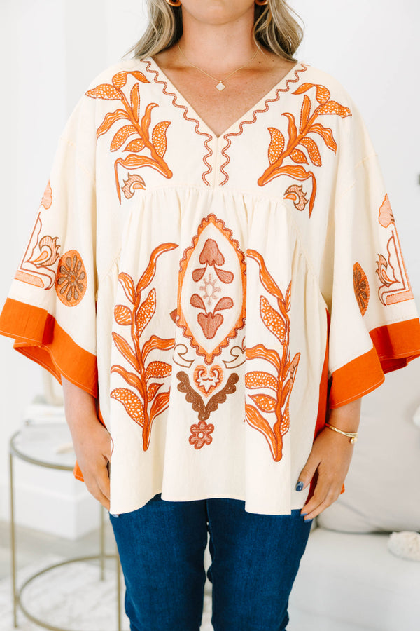 Plus size clothing, cream colored tunic top with orange embroidery