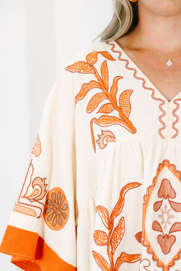Plus size clothing, cream colored tunic top with orange embroidery