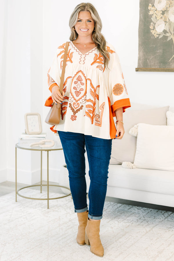 Plus size clothing, cream colored tunic top with orange embroidery