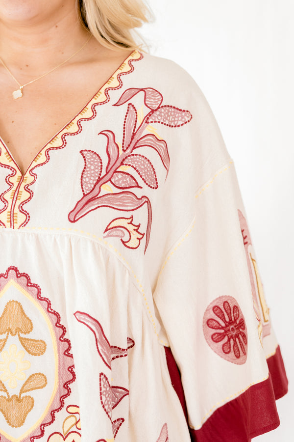 Chic Soul plus size clothing, ivory 3/4 bell sleeve v neck top with burgundy, pink, and gold embroidery detailing