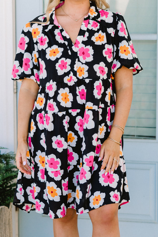Chic Soul plus size clothing, black short sleeve tiered mini dress with v neckline and puff sleeves with large orange and pink floral pattern